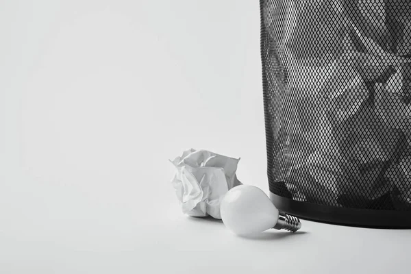 Close Shot Power Saving Light Bulb Crumpled Papers Office Trash — стоковое фото